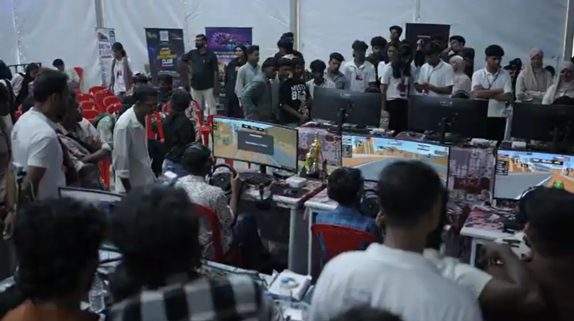 Large crowd watching and playing games at Infinite Pro League expo