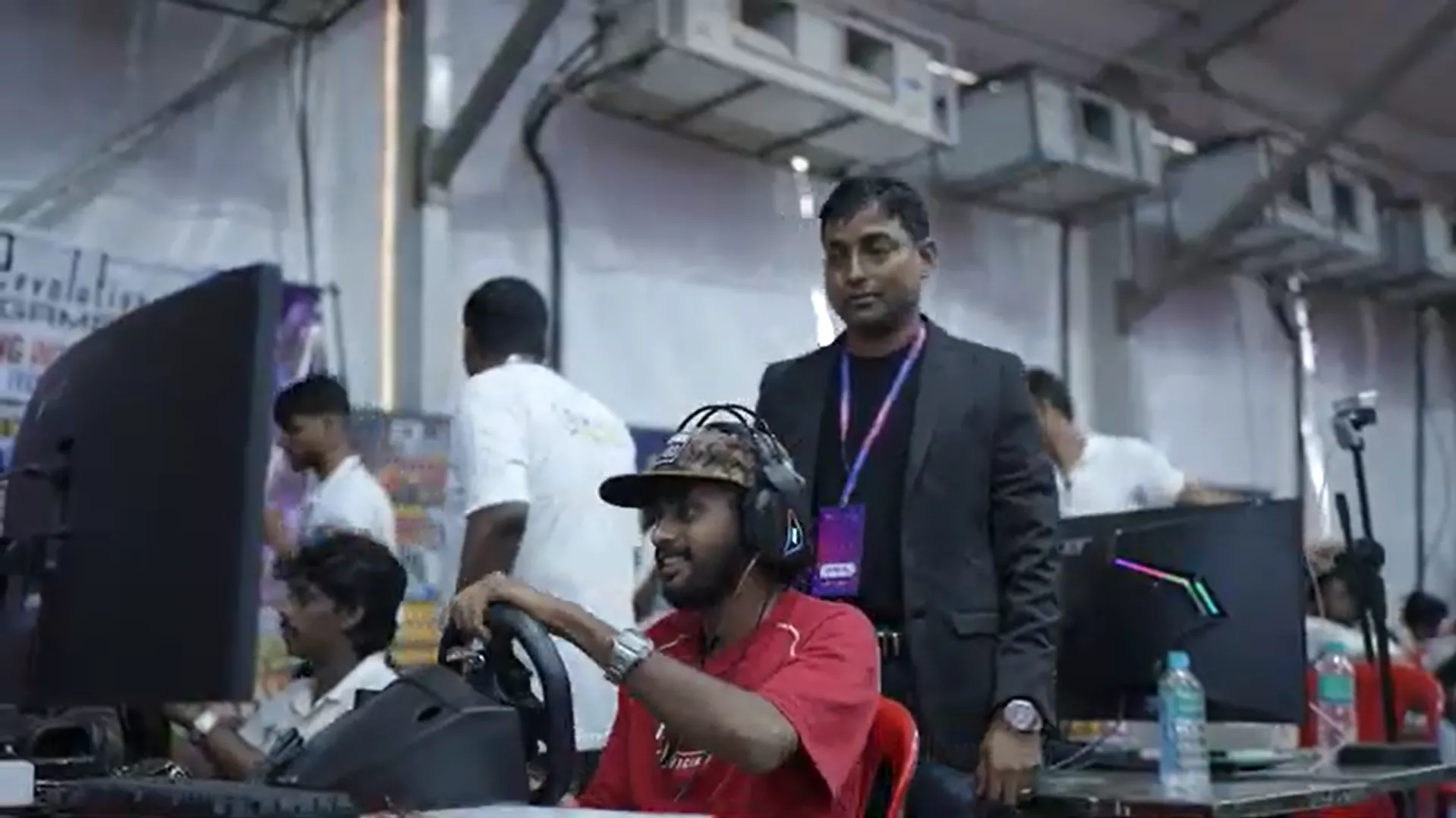 Event organizer managing crowd during Infinite Pro League tournament