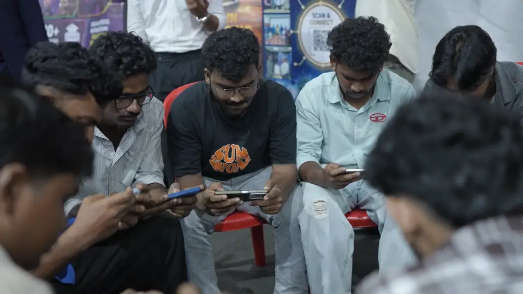 Players competing on smartphones at Infinite Pro League Kerala 2026 tournament